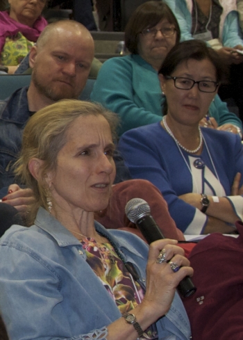 Susan Crate, Professor at George Mason University, poses a question to members of the discussion panel entitled, &#39;Arctic Futures, Sustainabilities and Strategic Environmental Research.&#39; Photo courtesy of Alona Yefimenko.